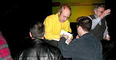 Photo of Jakob Nielsen signing a book for an attendee